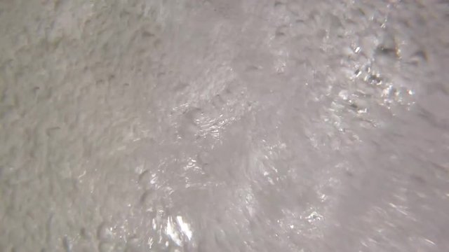 Action video shot of underwater splashes and bubbles in Soca valley in Slovenia.