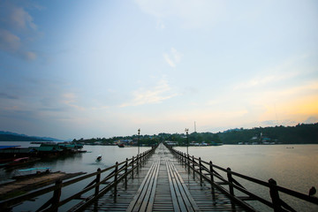 Fototapeta premium Longest Wood bridge in Thailand,Mon Bridge at Sangkhlaburi. Kanchanaburi. Thailand