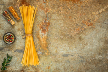 Fettuccine spaghetti pasta with tomatoes and herbs. Top view