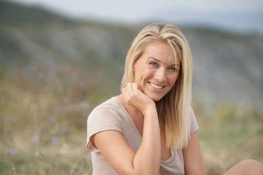 Fototapeta Portrait of beautiful 40-year-old blond woman