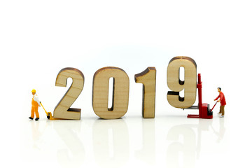 Miniature people : Worker with wooden of number 2019,Happy New Year 2019 concept.