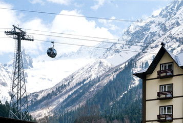 cable car on a background of mountains over the buildings ,the funicular