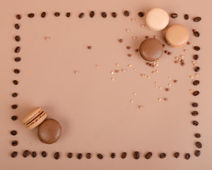 Deliious juicy makaroner, on beige color cappuccino background.