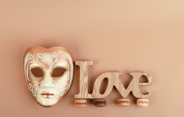 Deliious juicy makaroner, on beige color cappuccino background.