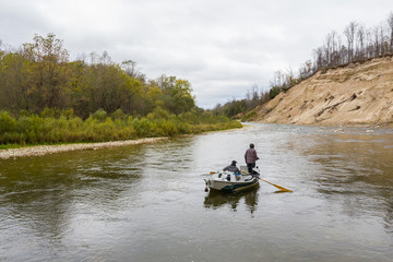 Aerial drone shot of drift boat fly fishing in Ontario, Canada