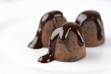 Chocolate truffles with chocolate sauce