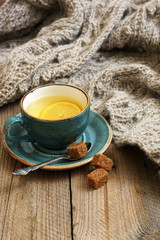 Still life with tea and knitwear