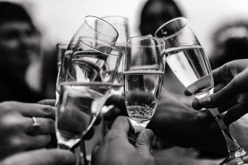 hands and glasses of champagne. on photo there is noises
