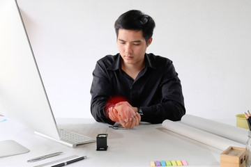 Fototapeta na wymiar Office syndrome concept, Man holding wrist pain from using computer.