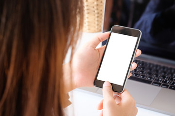 Top view a woman using mockup smartphone mobile with clipping path.