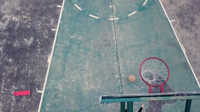 slow motion of girl practice basketball at yard after school 