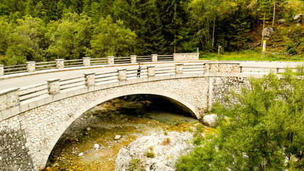 Naklejka premium Aerial view of bridge on Soca river in national park Triglav - Slovenia, Near the river source