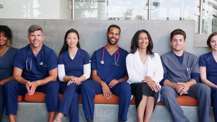 Group of smiling male and female healthcare professionals - Powered by Adobe