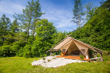 Glamping tent exterior in Adrenaline Check eco camp in Slovenia. - 229322289