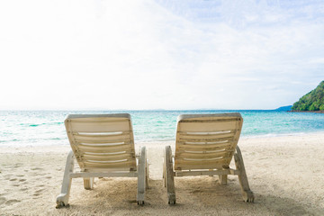 Two chair on sand beach in afternoon