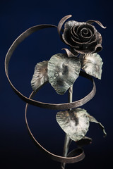 The broze rose with a tape made of metal