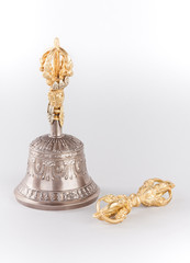 Traditional for Tibetan Buddhism a ritual hand bell and a dorje - symbols of unity of wisdom and sympathy. Are isolated on a white background.