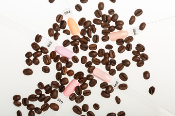Color nails with coffe seeds on white background