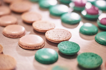 macaroons shells in a tray. Process of making macaron, french dessert,