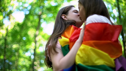 Lesbians kissing outdoor, minority rights protection, public declare of equality