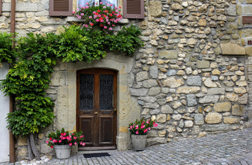 Fototapeta na wymiar View of a Beautiful House Exterior and Front Door in an old Swiss town