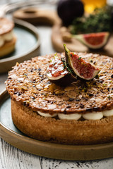 Tarte on sand base with fresh figs, almonds and crispy waffle with almonds and cocoa powder. Fresh Homemade Fruit Tart with berries