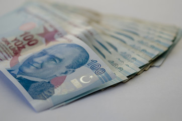 One hundred Turkish liras banknots on white background