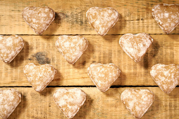 Christmas cookies in the shape of a heart on an old wooden table