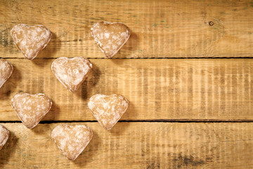 Christmas cookies in the shape of a heart on an old wooden table