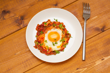 Fried egg on a white plate