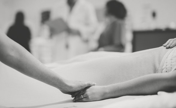 Nurse comforting a patient at the icu