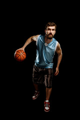 Running basketball player on black