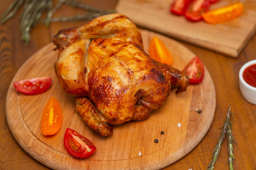 Roasted chicken on cutting board.