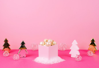 Christmas tree balls on a pink background.