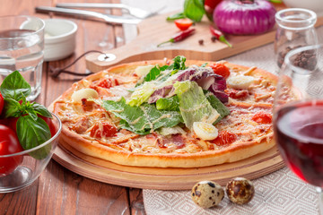 Delicious fresh pizza served on wooden table