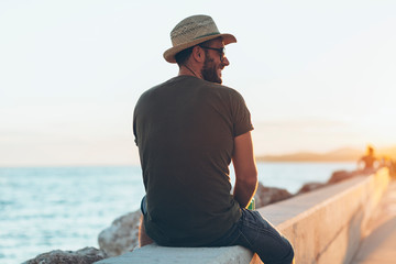 Man enjoying the sunset in the harbor