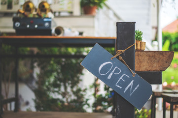 open sign wood with soft-focus and over light in the background