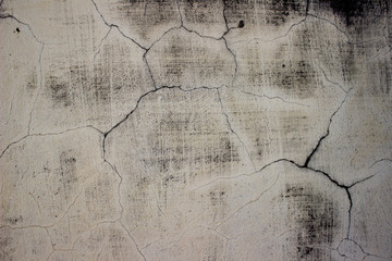 Old cracked white concrete wall texture background