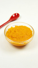 Mashed carrot in glass bowl, baby food