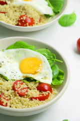 Savory Breakfast Quinoa with Spinach, Tomatoes and Fried Eggs
