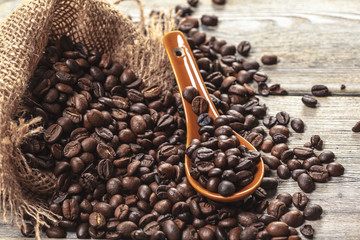 Roasted coffee beans on a wooden floor