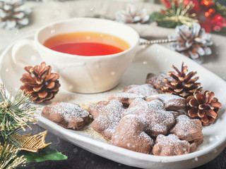 Christmas or new year card. Winter holiday composition, side view, selective focus, blue, gray background. Tea, cookies