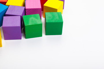 Obraz premium Colorful wooden building blocks isolated on white background