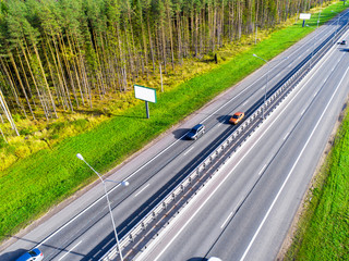 Aerial view of highway. Car crossing interchange overpass. Highway interchange with traffic. Aerial...