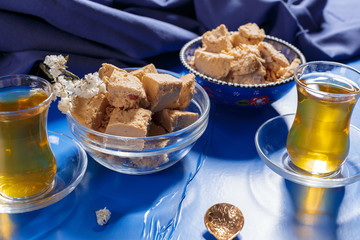 Tasty halva with tea on the table