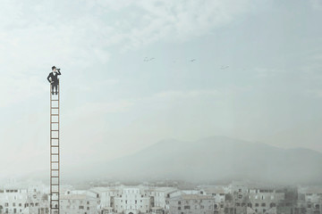 businessman at the top of a long ladder observes the city with his binoculars