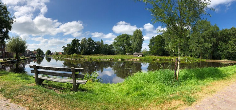 Bench next to the canal of the turfroute in Gorredijk