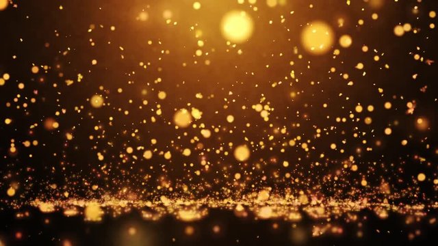Golden particles fall to the ground and explode into small particles. Falling golden particles. VDO about  falling particles use for a wide variety of topics such as put a text, logo, or background.