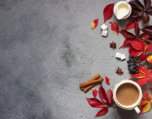Cup of coffee, spices, sugar cubes, autumn leaves. Autumn decor, fall mood, relaxing and still life concept. Flat lay, top view. Copy space.