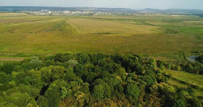 Aerial view of beautiful ancient fortress in forest in summer. Tarakaniv Fort.